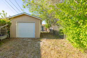 Detached garage featuring driveway