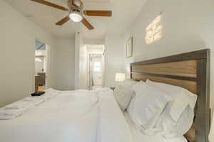 Bedroom featuring ceiling fan and connected bathroom