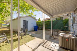 View of patio / terrace with an outbuilding