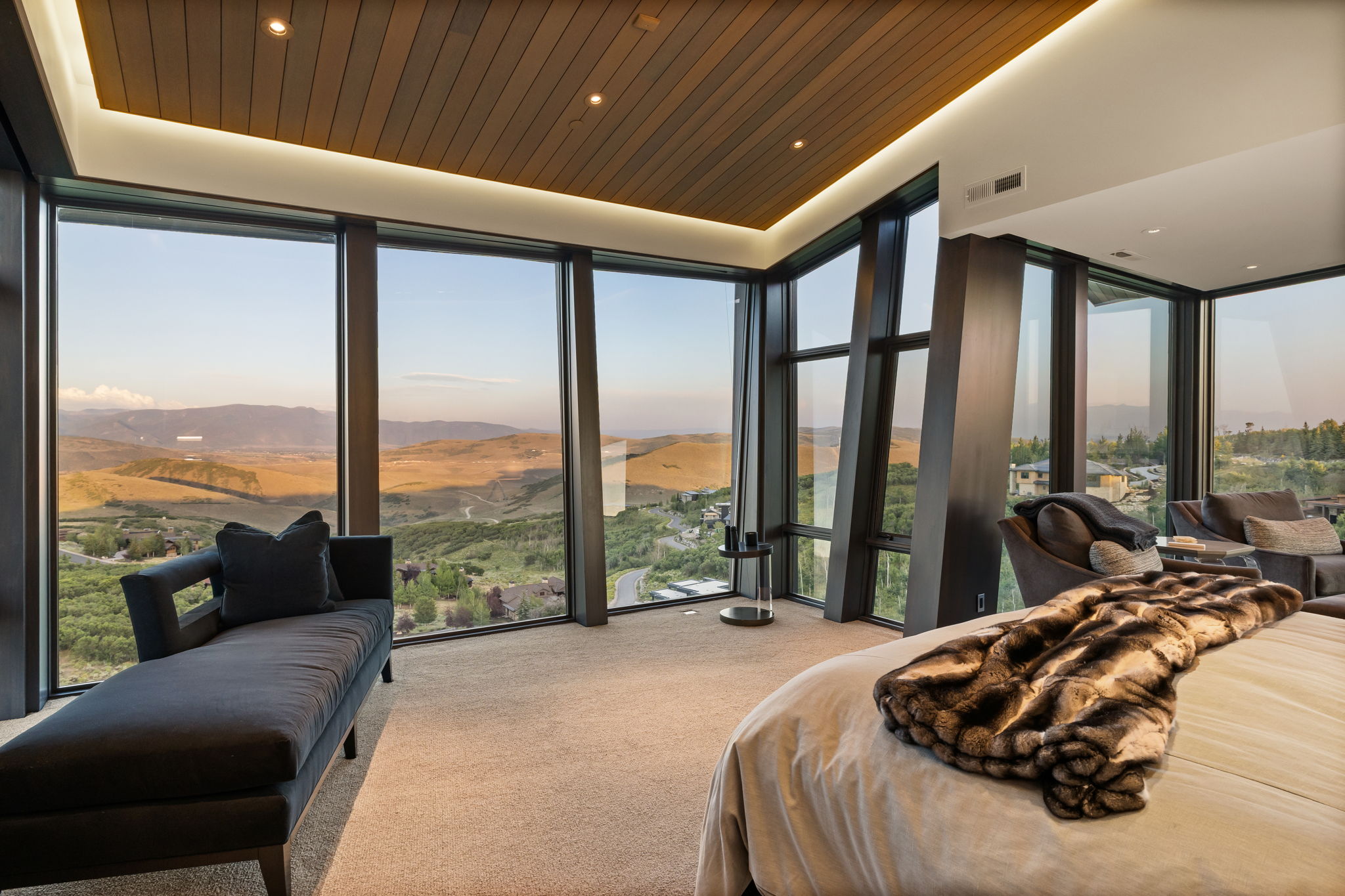 Carpeted bedroom with expansive windows, a mountain view, recessed lighting, and wooden ceiling