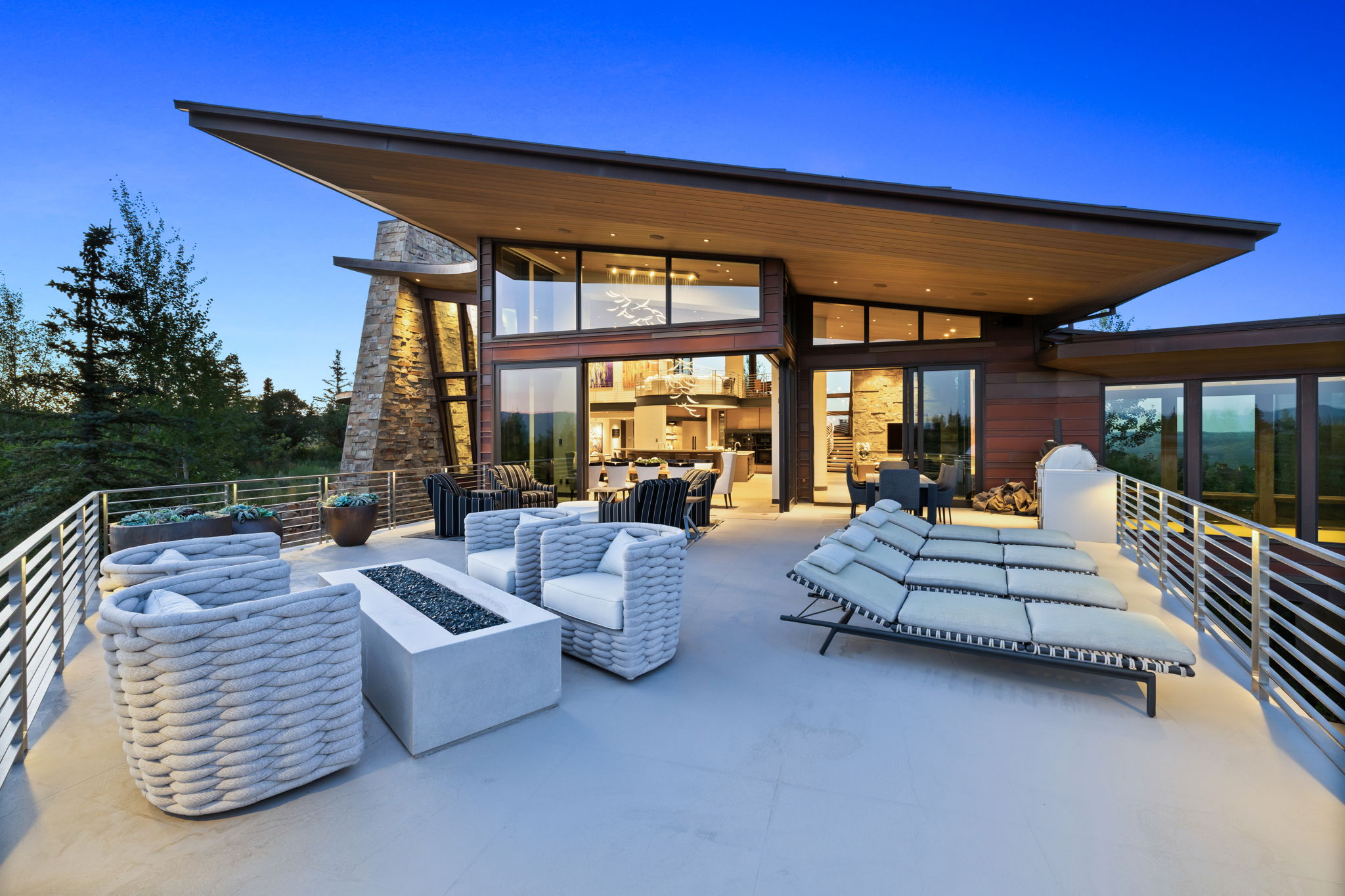 View of patio with an outdoor living space with a fire pit