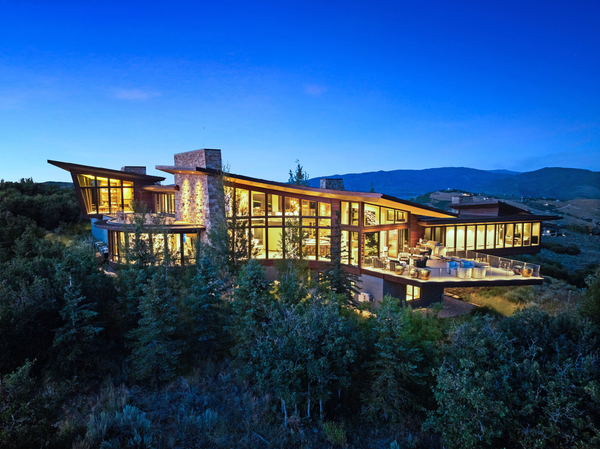 Rear view of property featuring a chimney and a mountain view