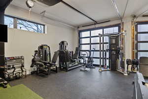 Exercise room with a garage