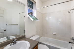 Bathroom featuring vanity and  shower combination