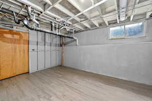 Below grade area featuring wood finished floors