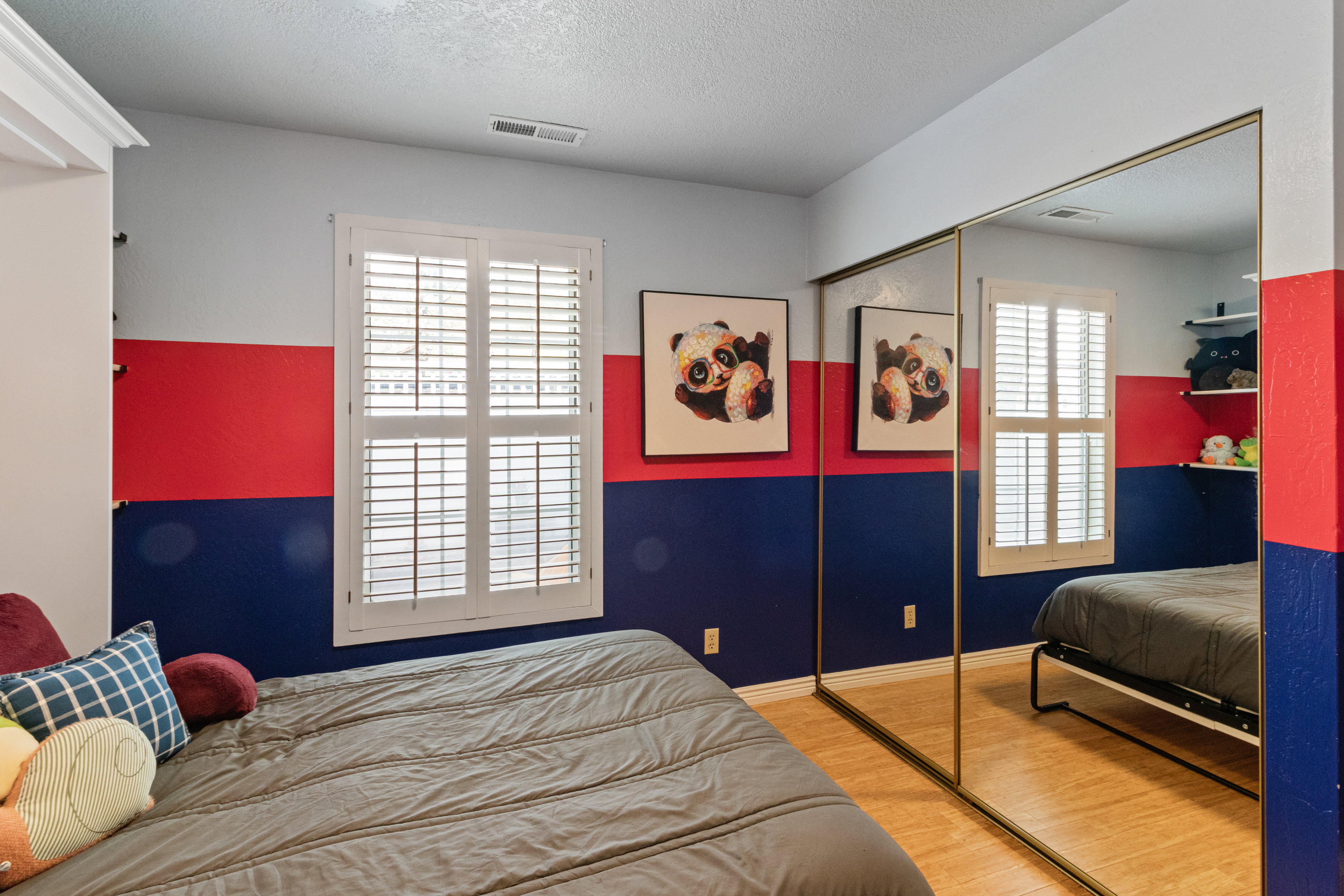 Bedroom featuring a closet, a textured ceiling, and light wood-style flooring
