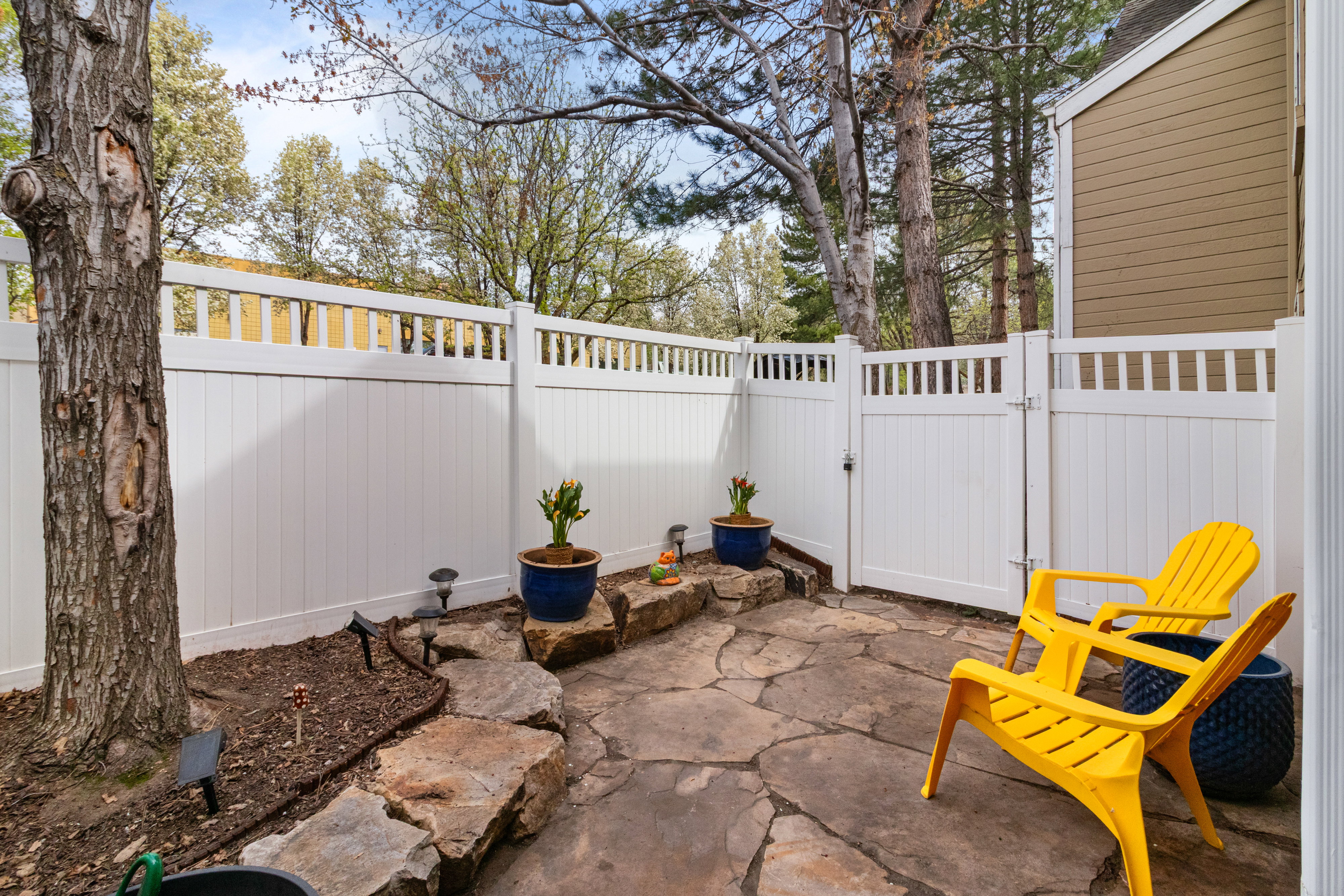 View of patio with a gate
