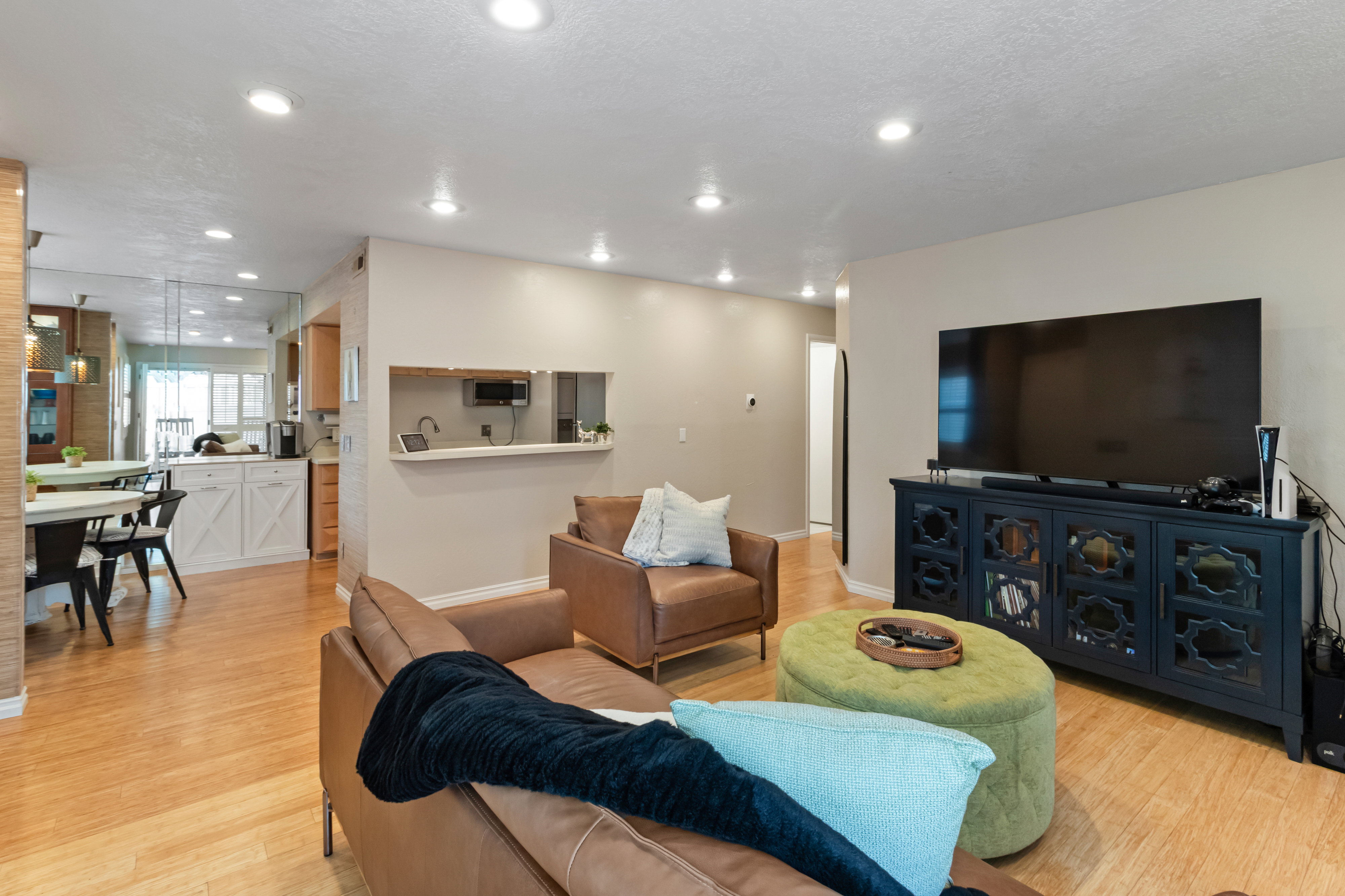 Living area featuring light wood-style floors and recessed lighting