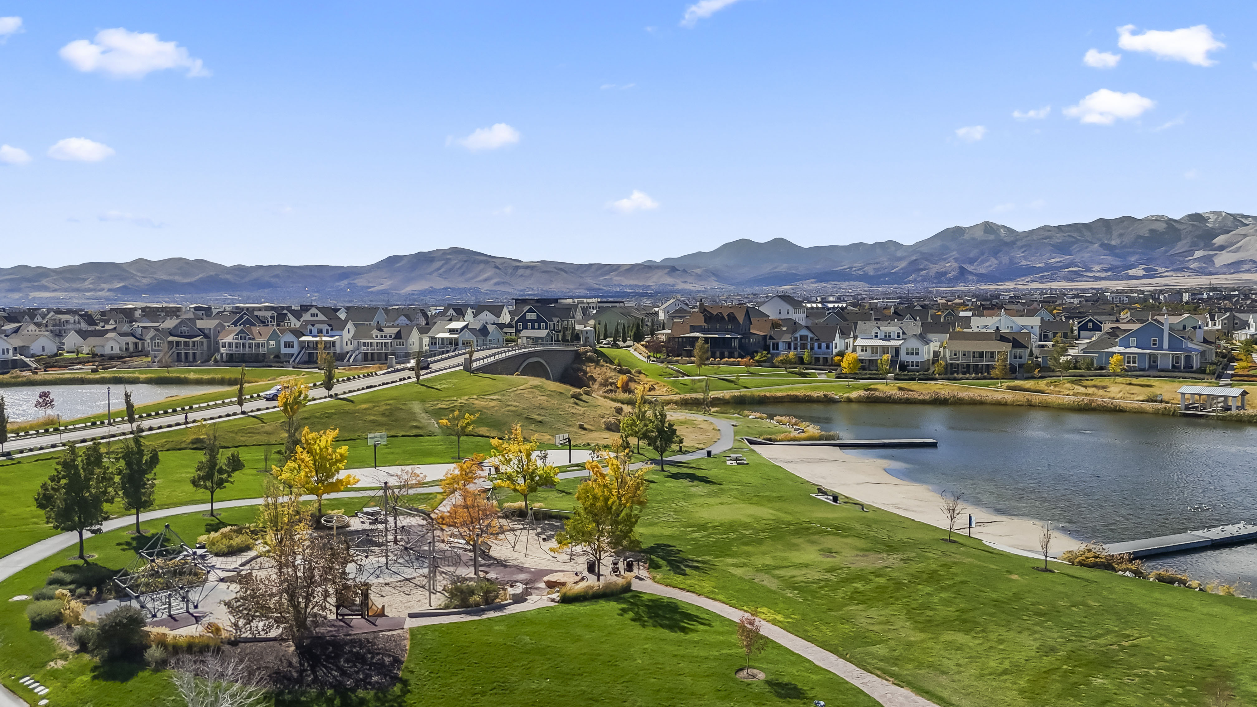 Aerial perspective of suburban area featuring a water and mountain view