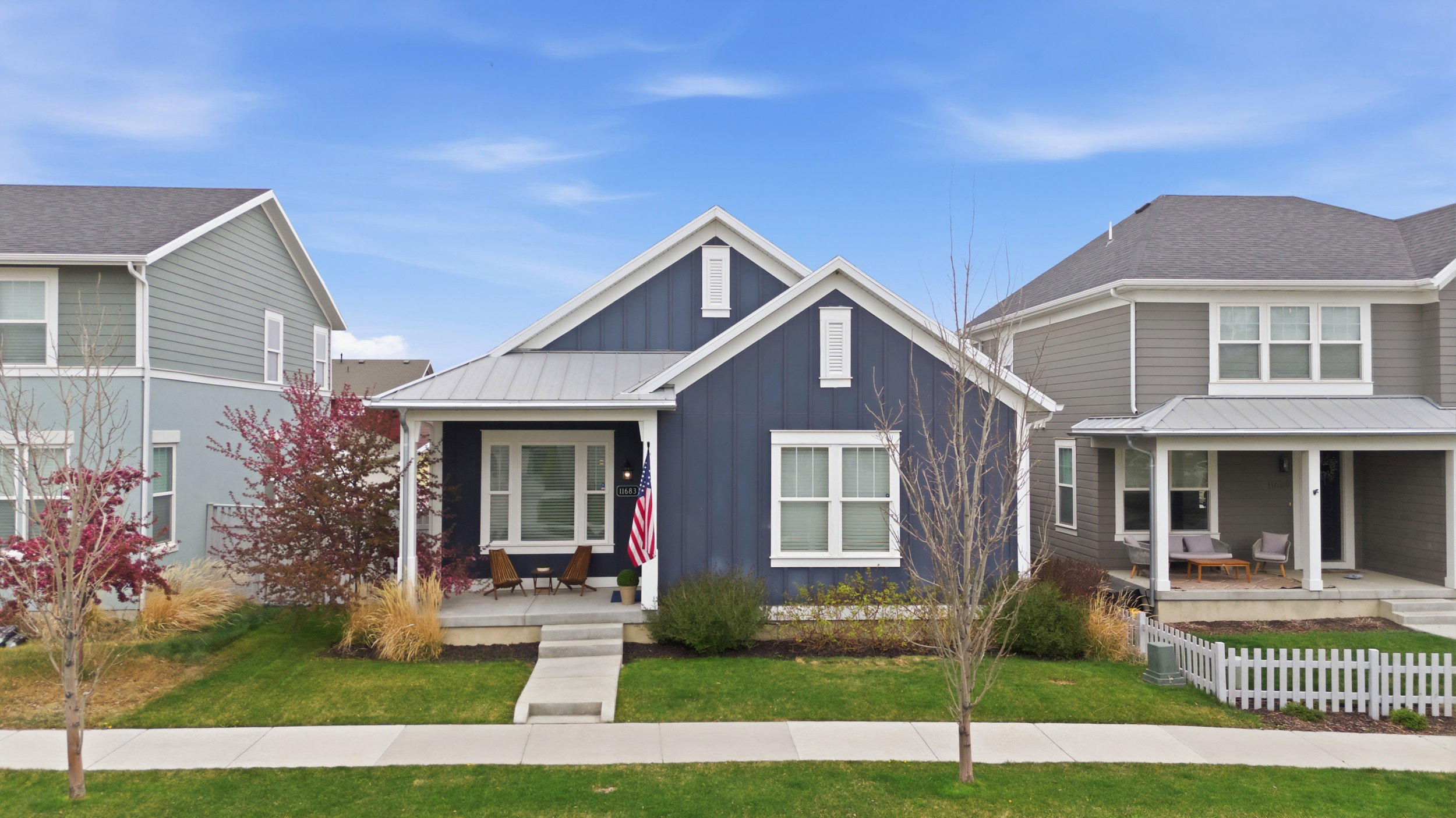 View of front of home featuring board and batten siding and covered porch