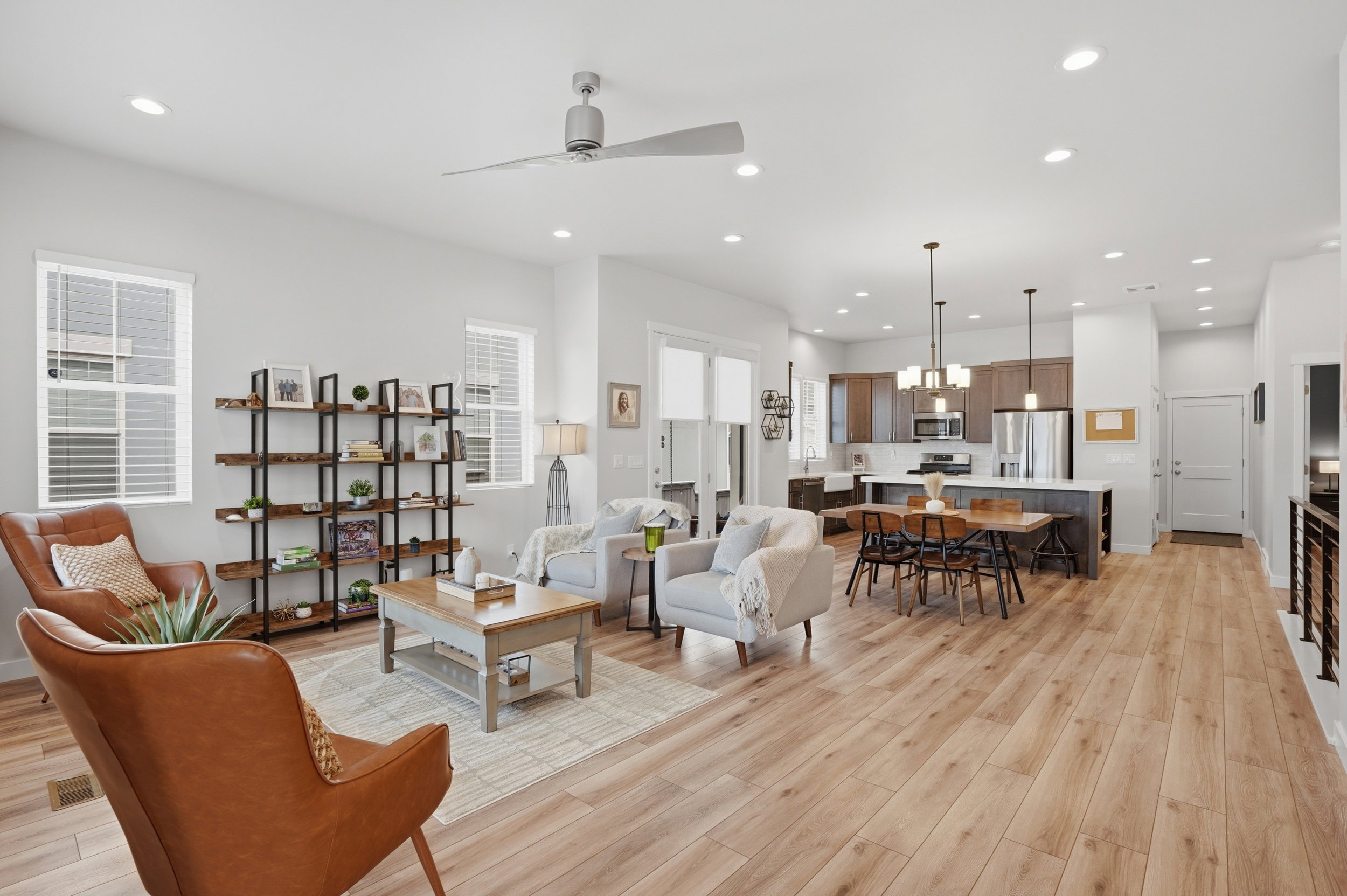Living room featuring a ceiling fan, light wood finished floors, and recessed lighting