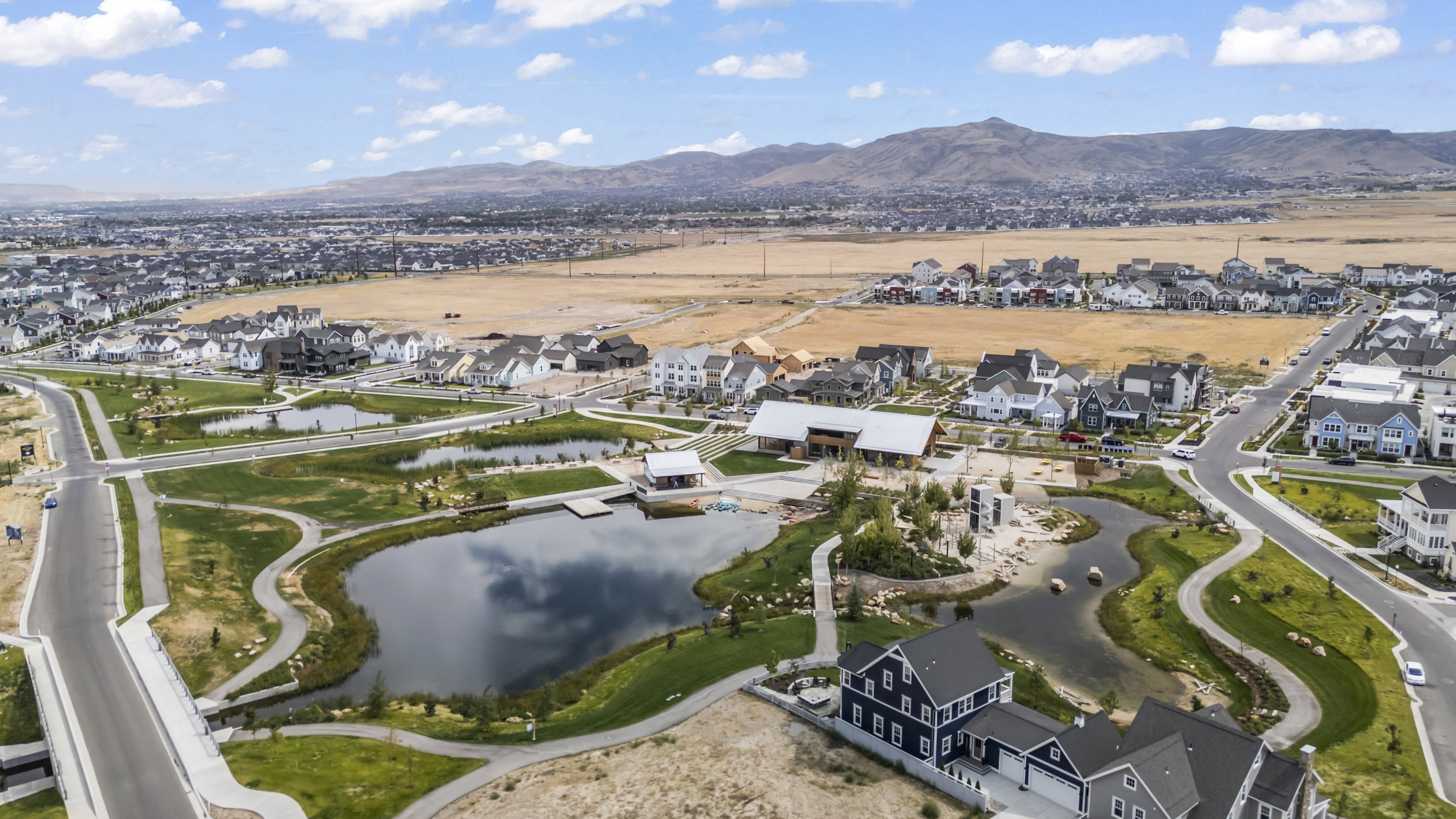 View of property location with nearby suburban area and a water and mountain view