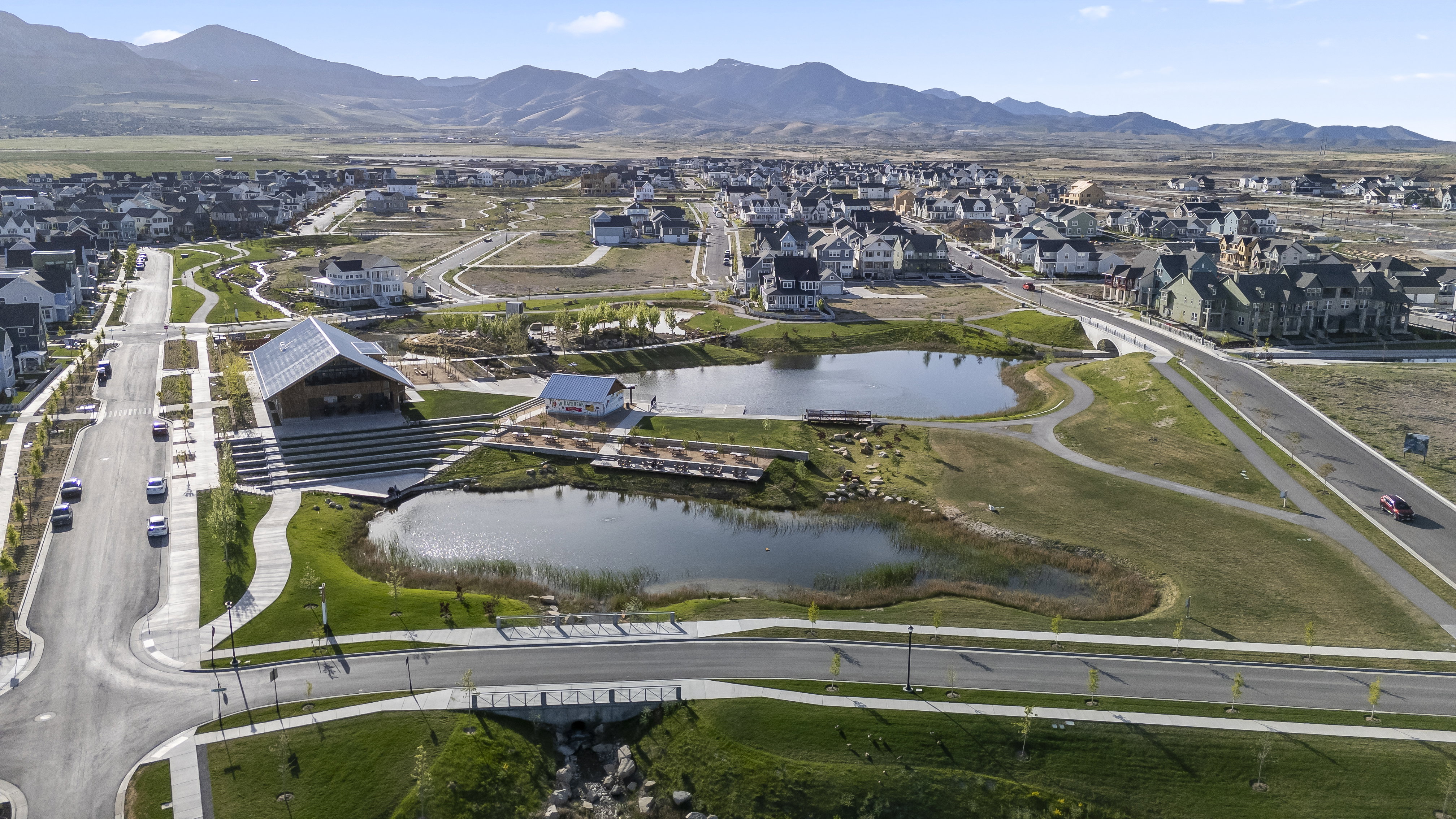 View of property location featuring nearby suburban area and a water and mountain view