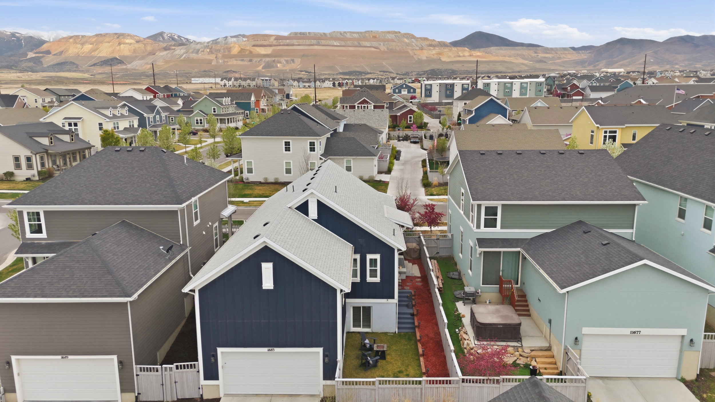 Aerial view of residential area featuring a mountainous background