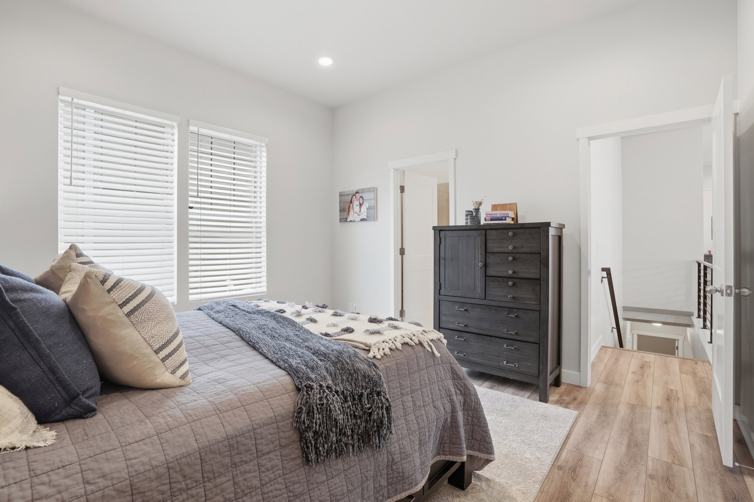 Bedroom with wood finished floors and recessed lighting