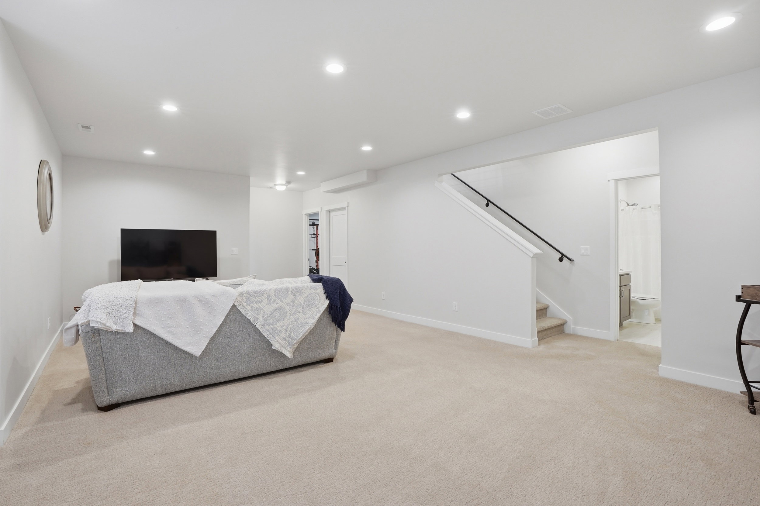 Living room featuring recessed lighting and light carpet