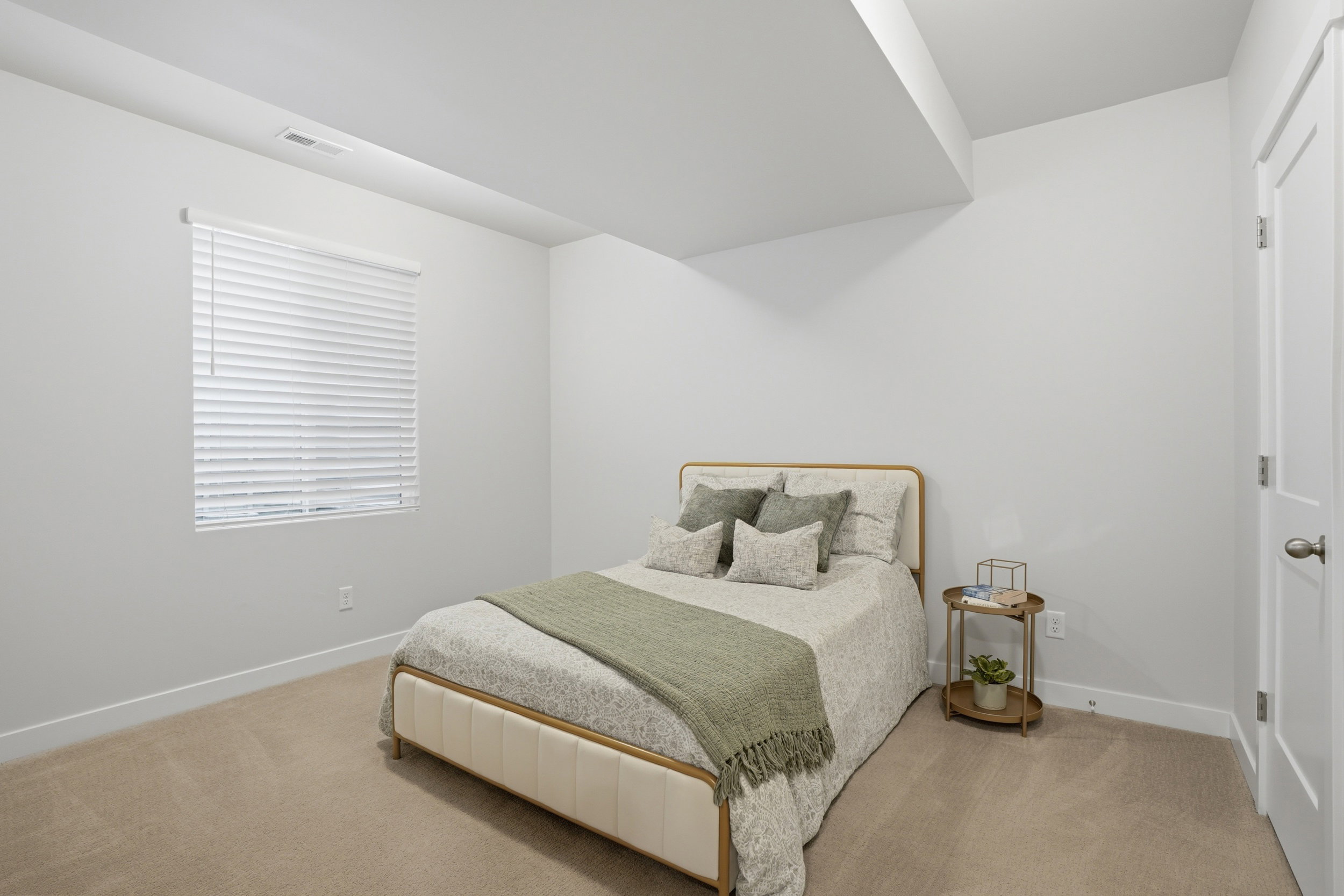 Bedroom with light carpet