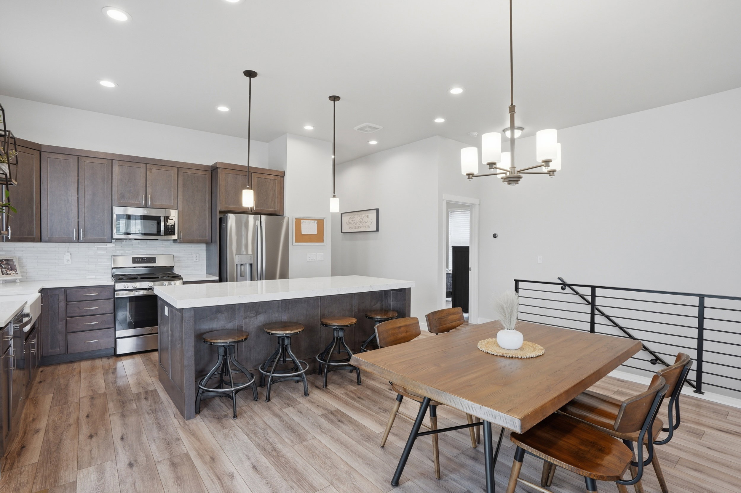 Dining space featuring light wood-style flooring and hanging lights