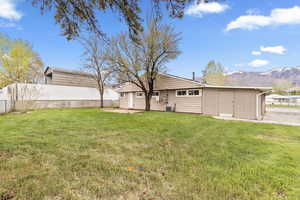 View of yard featuring a mountain view and a patio
