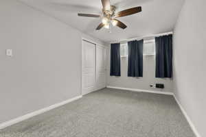 Unfurnished bedroom with carpet floors, a closet, and a ceiling fan