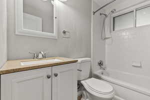 Bathroom featuring vanity and shower / tub combination