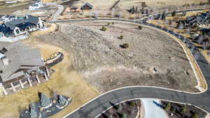 Aerial overview of property's location featuring nearby suburban area