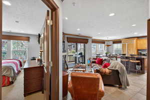 Living area with a textured ceiling and recessed lighting