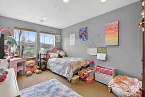 Bedroom with light carpet