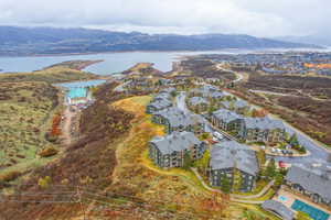 Aerial perspective of suburban area featuring a water and mountain view