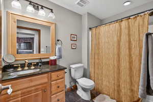 Bathroom featuring vanity and a shower with curtain