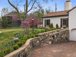 View of patio featuring concrete driveway