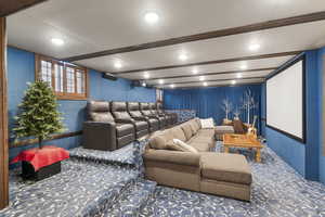 Cinema featuring carpet flooring, beam ceiling, and recessed lighting
