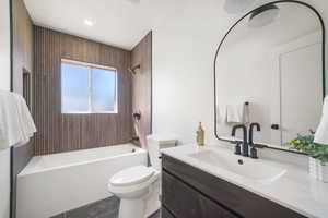 Full bathroom with vanity and washtub / shower combination