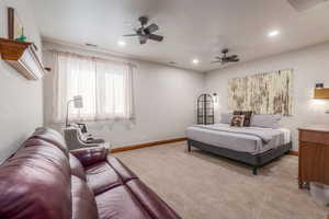 Bedroom with carpet, a ceiling fan, and recessed lighting
