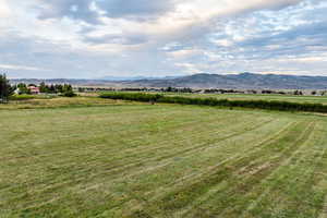 View of mountain backdrop with rural landscape