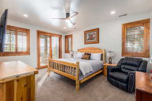 Carpeted bedroom with access to outside, a ceiling fan, and recessed lighting