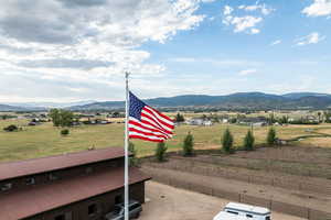 View of mountain backdrop with rural landscape