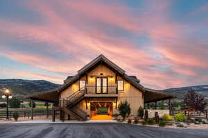Chalet / cabin with a mountain view, board and batten siding, and french doors