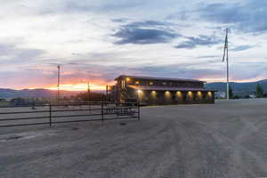 Property at dusk featuring a mountain view