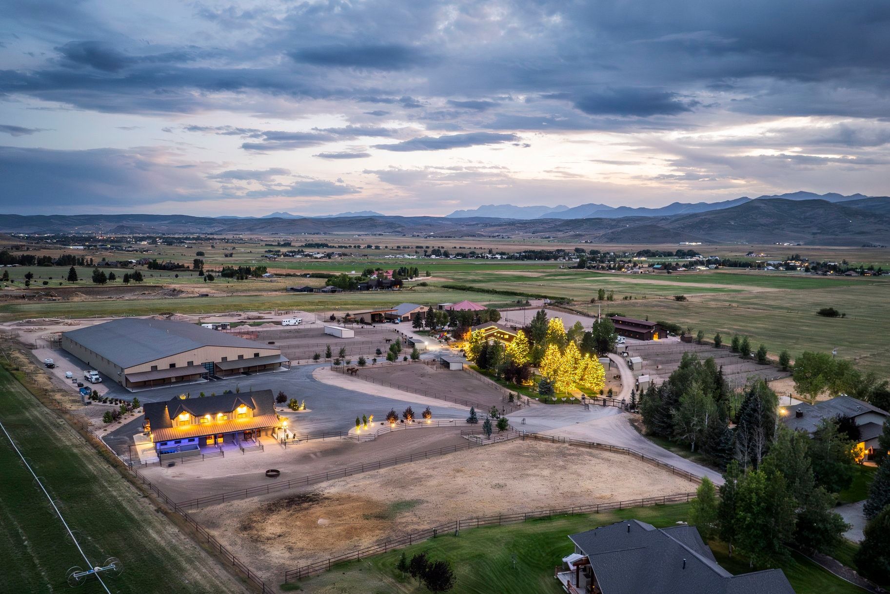 Aerial view at dusk of a view of rural / pastoral area and a mountain view