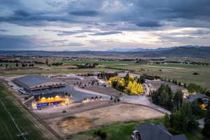Aerial view at dusk of a view of rural / pastoral area and a mountain view
