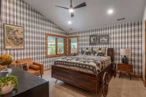 Bedroom featuring lofted ceiling, recessed lighting, wallpapered walls, and a ceiling fan