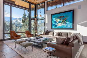 Sunroom / solarium featuring a mountain view