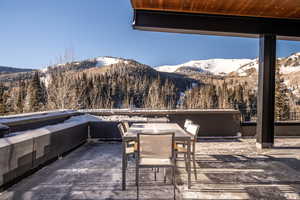 View of patio / terrace with outdoor dining area and a mountain view
