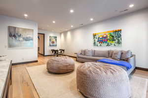 Living area featuring recessed lighting and light wood-style floors