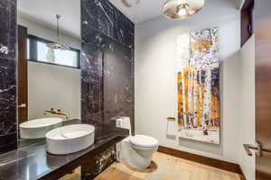 Half bath featuring vanity and light wood-style flooring