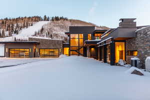 View of front facade with stone siding and a mountain view