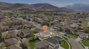 Aerial perspective of suburban area featuring a mountainous background
