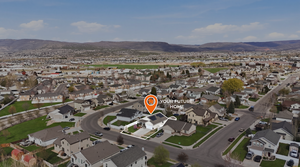 Aerial perspective of suburban area featuring mountains
