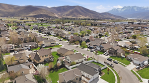 Aerial perspective of suburban area with a mountainous background